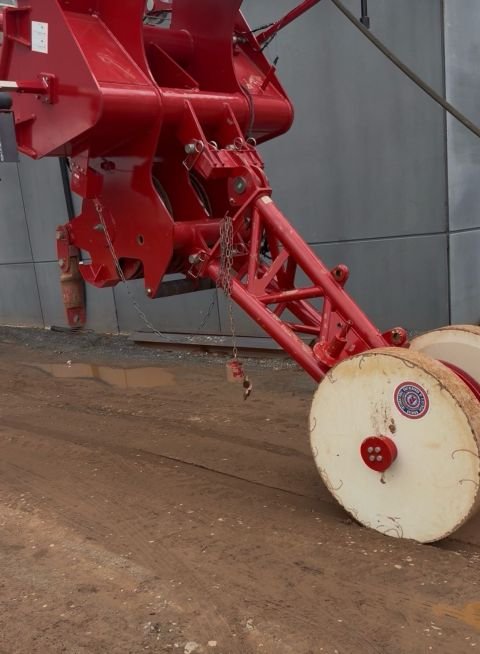 Red crane boom and reeving gear as the crane is returned to working position
